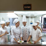 Happy chesfs at recommended restaurant, Chanrey Tree, In Wat Bo in Siem Reap