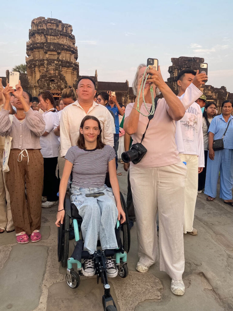 Wheelchair user watching Angkor Wat sunrise equinox in Siem Reap