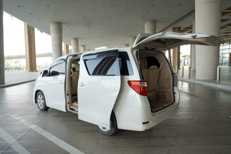 Toyota Alphard luggage space with rear door open for airport transfers