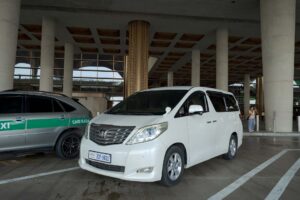 Toyota Alphard airport transfer vehicle front view in Cambodia