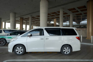 Toyota Alphard airport transfer vehicle side view in Cambodia