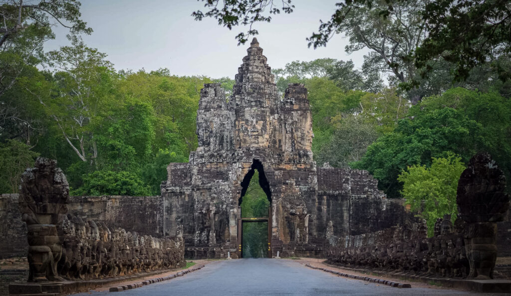 South Gate of Angkor Thom with stone gods and demons lining the causeway near Siem Reap, Cambodia.