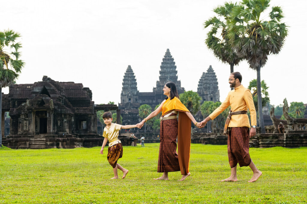family in traditional cambodian clothes at angkor wat