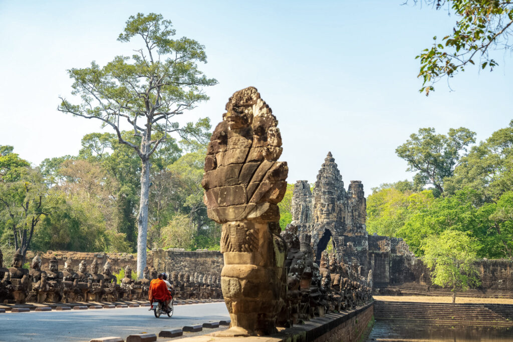 South Gate of Angkor Thom with stone naga balustrade and face tower, Angkor Archaeological Park, Cambodia