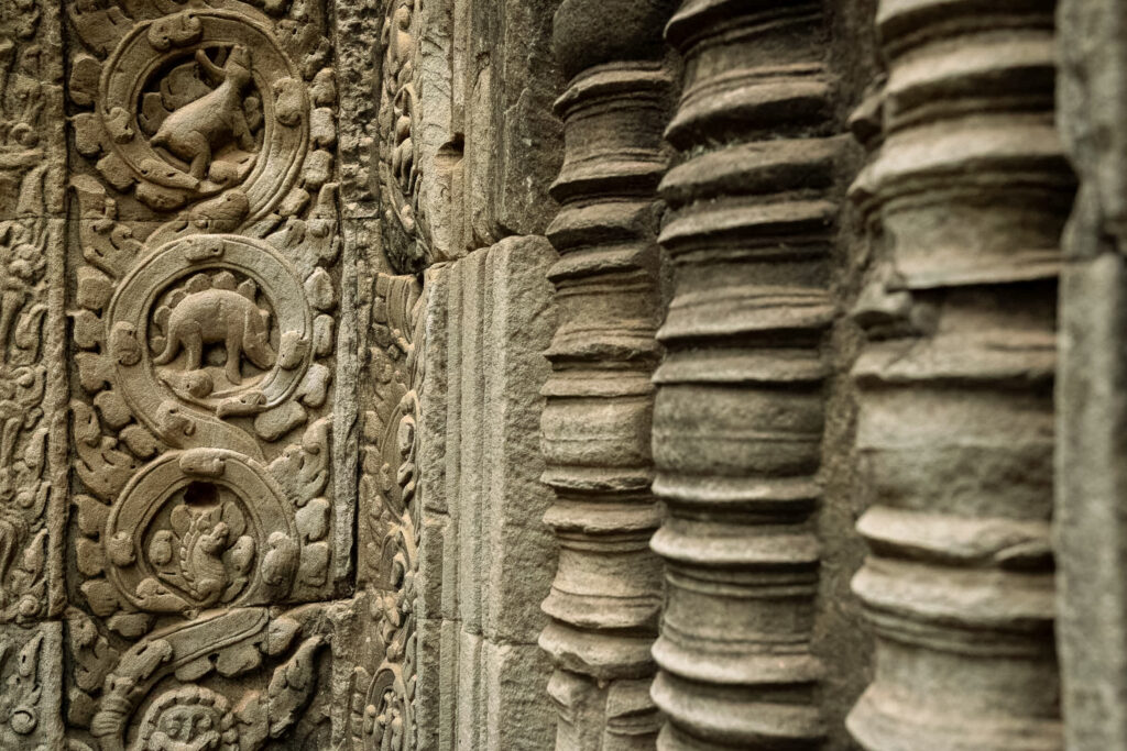 Famous “dinosaur” carving at Ta Prohm temple, often compared to a stegosaurus