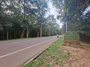 Road through the Angkor Archaeological Park leading towards Angkor Wat from Siem Reap