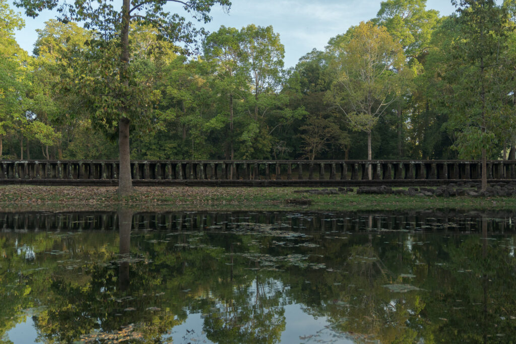 Long elevated causeway at Baphuon Temple surrounded by trees