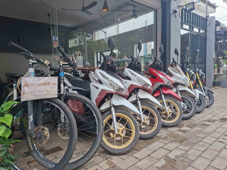 Bicycles and scooters available for rent at a shop in Siem Reap town