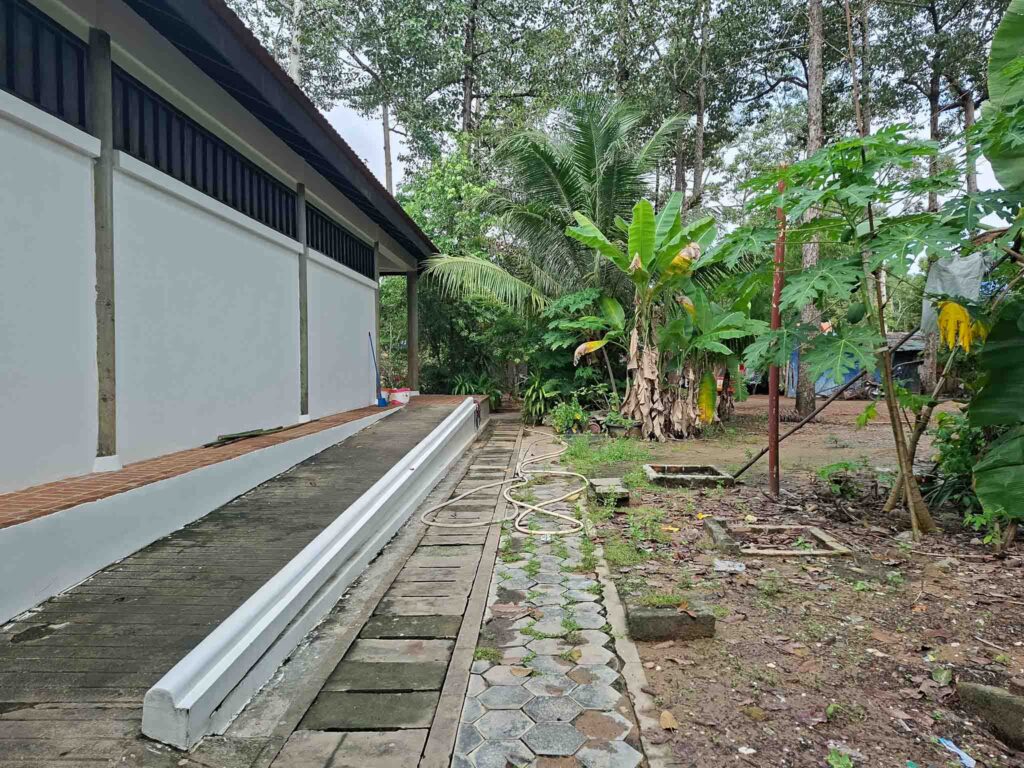 wheelchair ramp leading to toilets at ta prohm temple, siem reap, cambodia